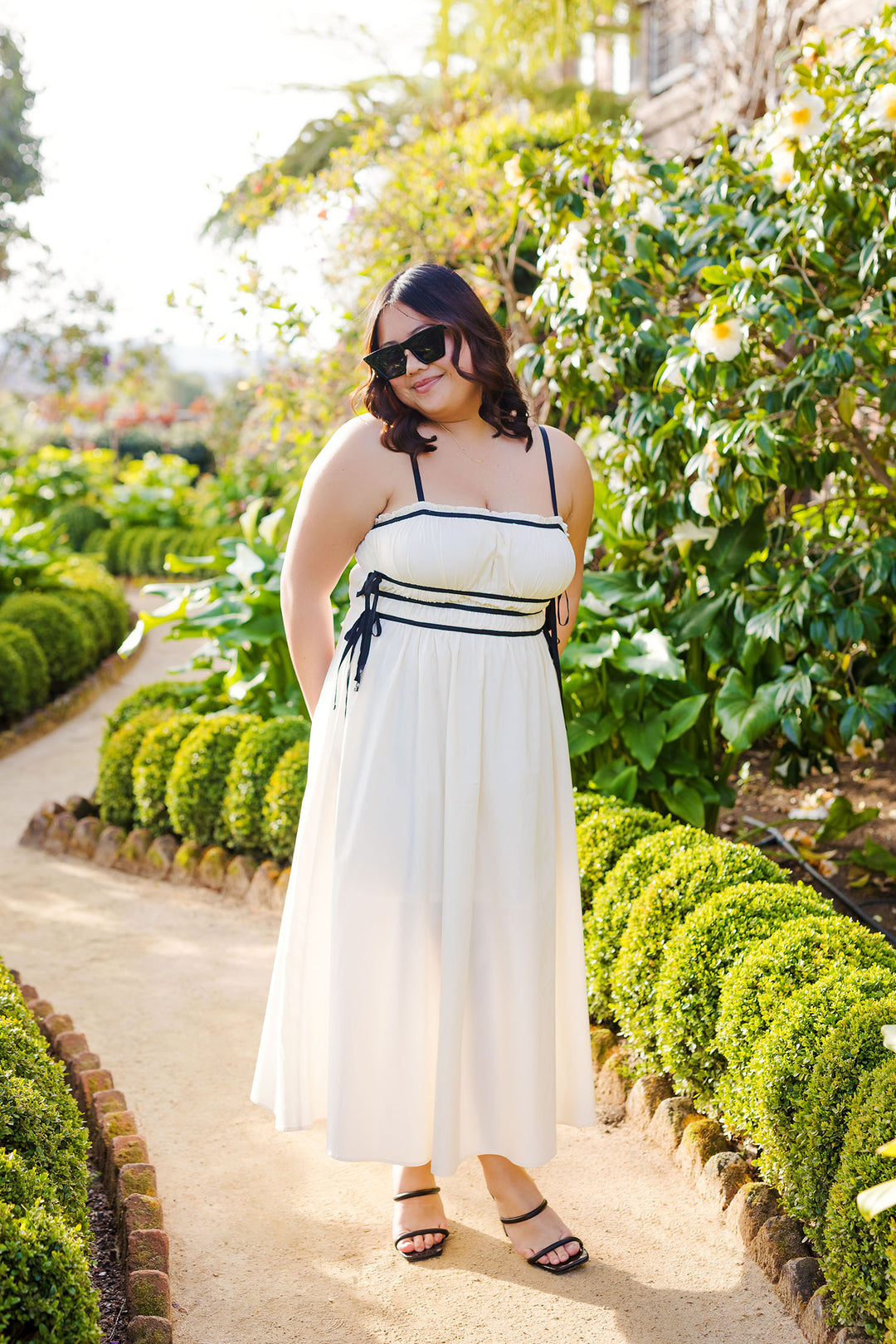 The First Glance Cream and Black Midi Dress