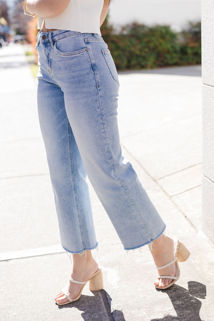 The Blue Koi Wide Leg Mid Rise Raw Hem Jeans