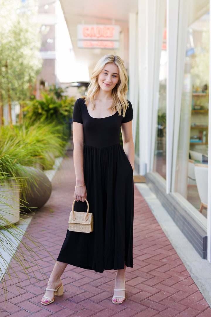 The Off the Record Black Wide Leg Jumpsuit