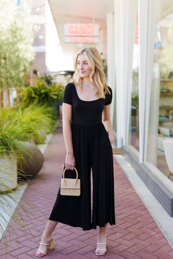 The Off the Record Black Wide Leg Jumpsuit